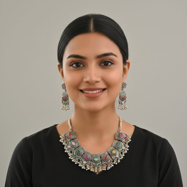 Oxidised Silver Multi-Color Stone Necklace Set image 3 Oxidised silver necklace set with multi-color stones and matching earrings displayed on a black jewellery stand.